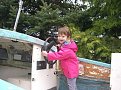 Granddaughter  (Ella) test driving the boat before I tear it apart.  Notice