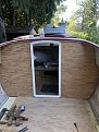 New cabin bulkhead and doorway.  this new door has a lip to keep water out of the cabin